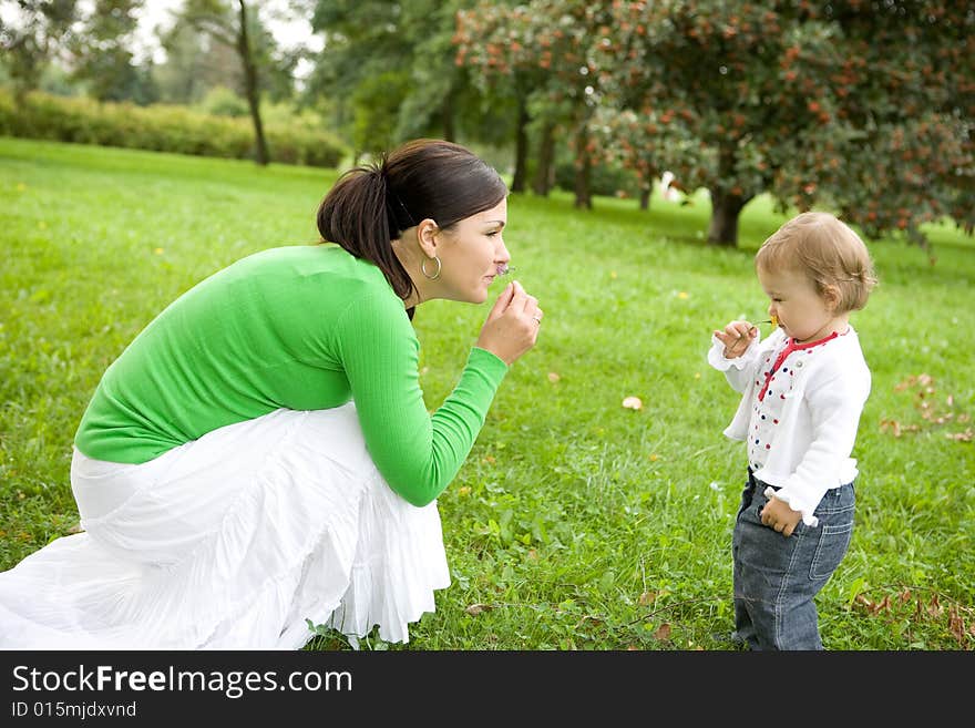 Happy family playing in park. Happy family playing in park