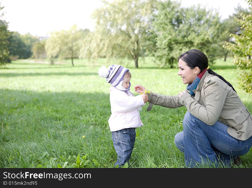 Happy family playing in park. Happy family playing in park