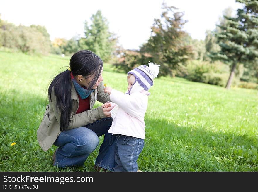 Happy family playing in park. Happy family playing in park