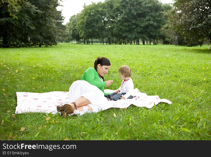 Happy family playing in park. Happy family playing in park