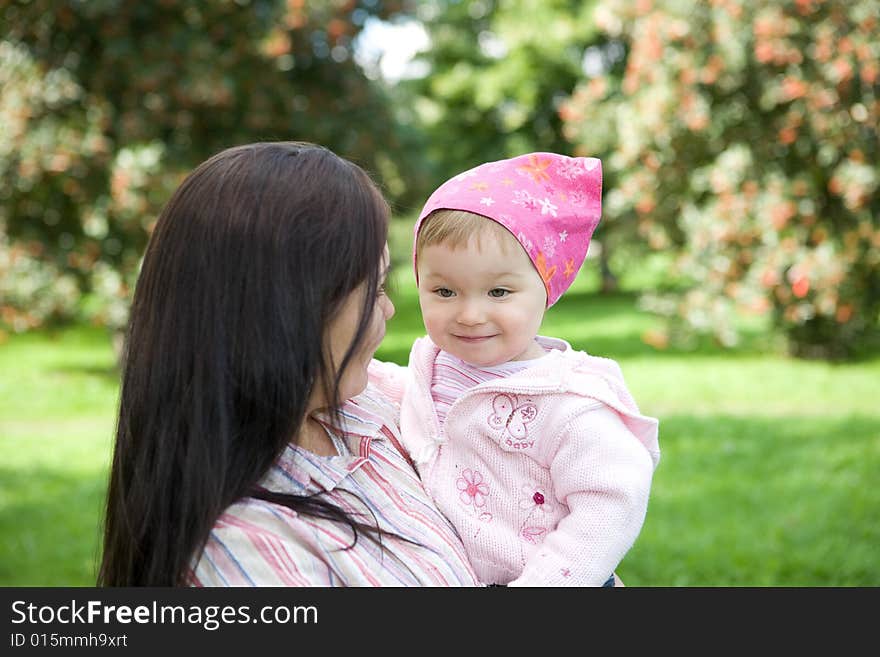 Happy family playing in park. Happy family playing in park