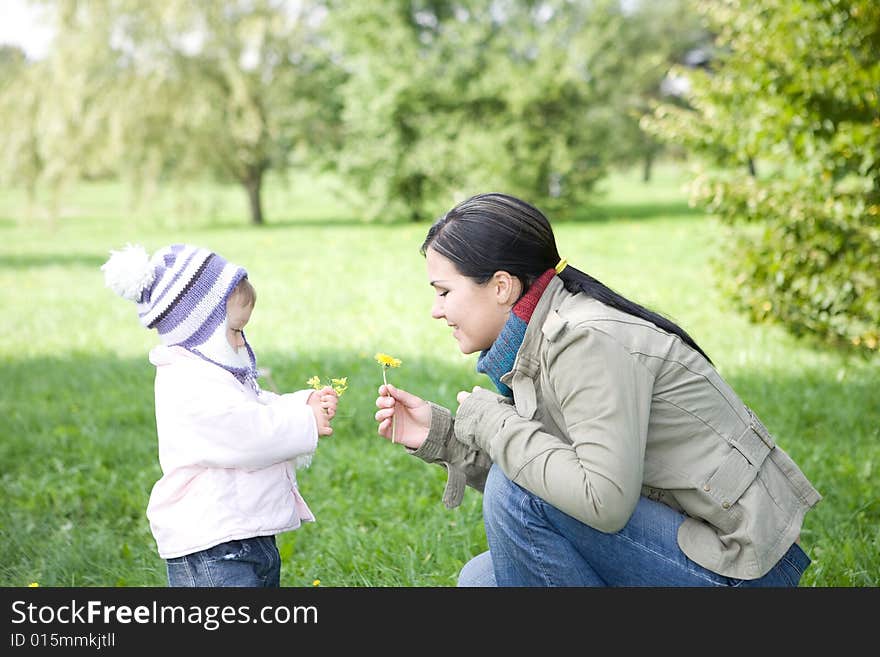 Happy family playing in park. Happy family playing in park