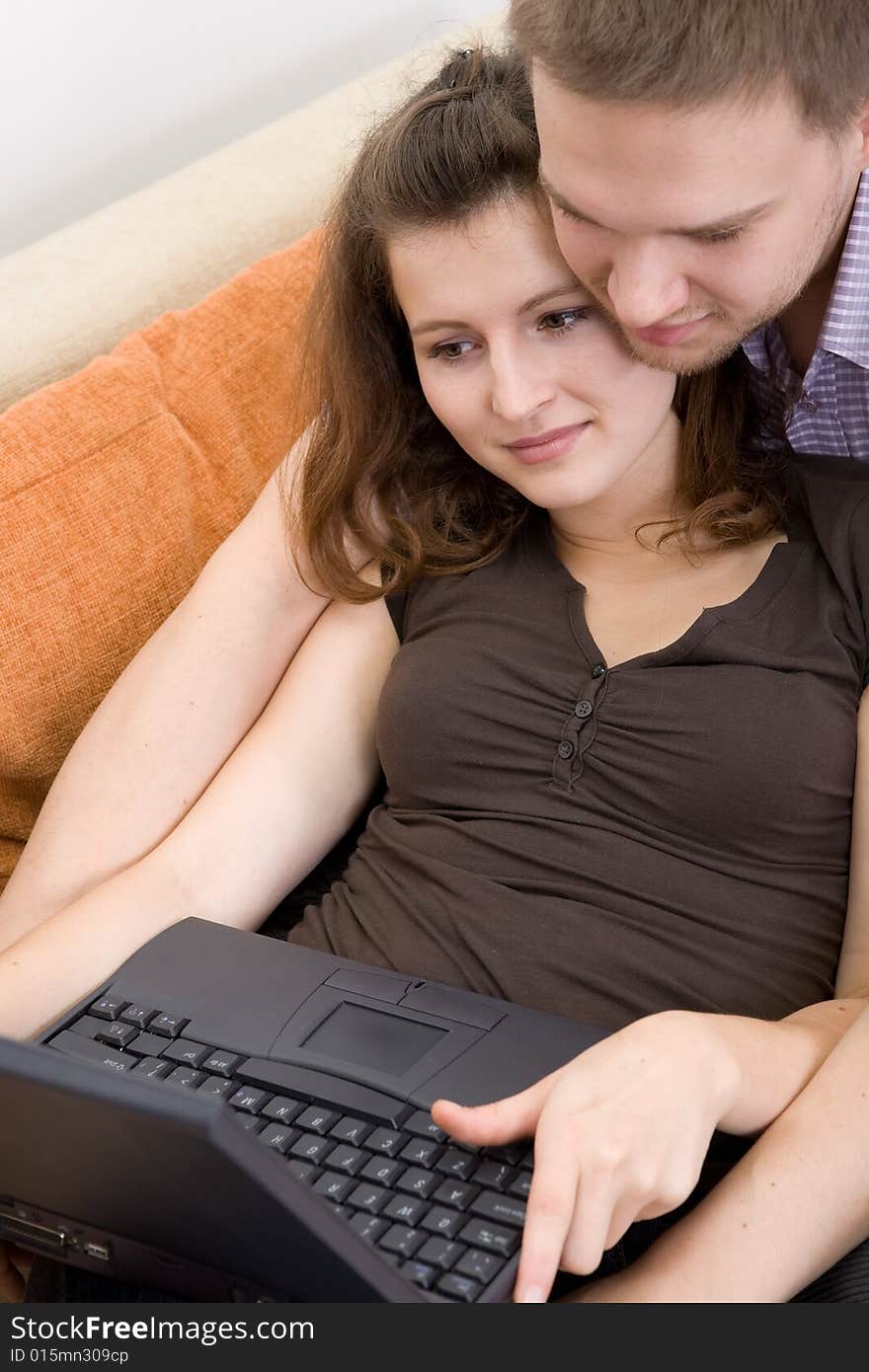 Casual couple together on sofa. Casual couple together on sofa