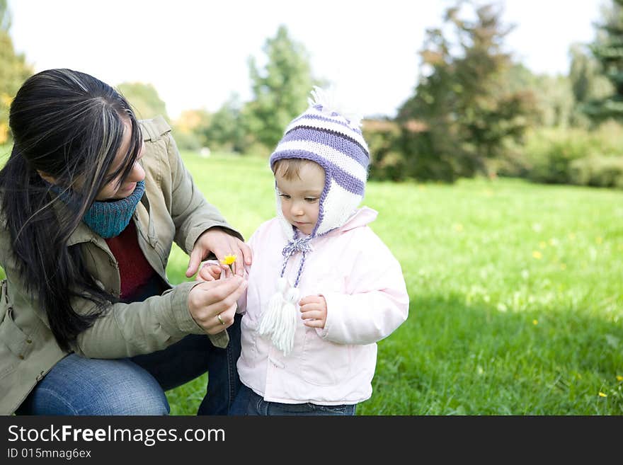 Happy family playing in park. Happy family playing in park