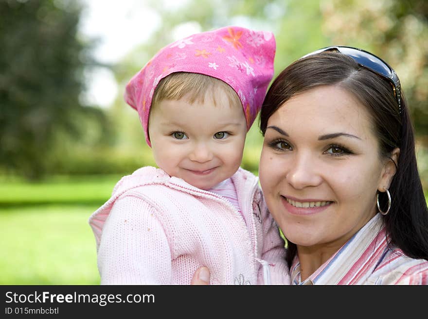 Happy family playing in park. Happy family playing in park