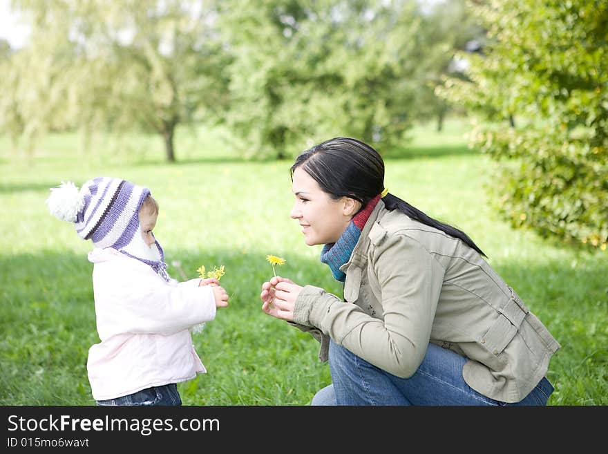 Happy family playing in park. Happy family playing in park