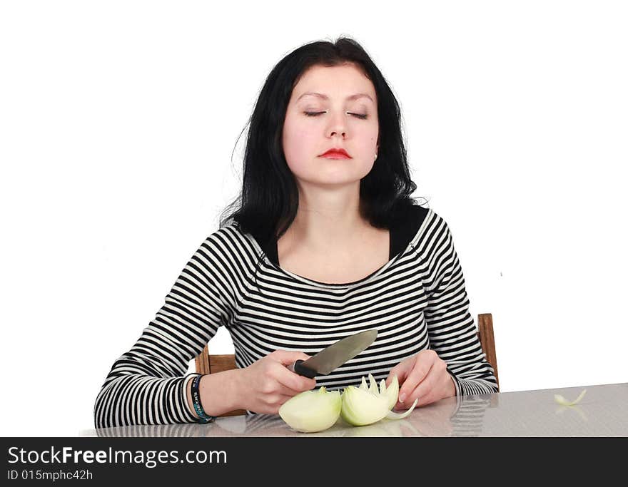 Woman cutting onion in the Kitchen. Woman cutting onion in the Kitchen