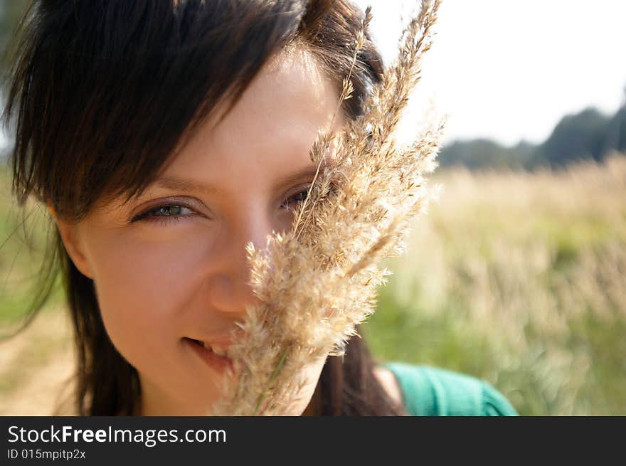 Young happy woman in the meadow. Young happy woman in the meadow