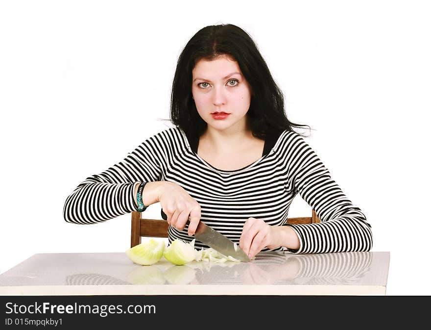 Woman cutting onion in the Kitchen. Woman cutting onion in the Kitchen