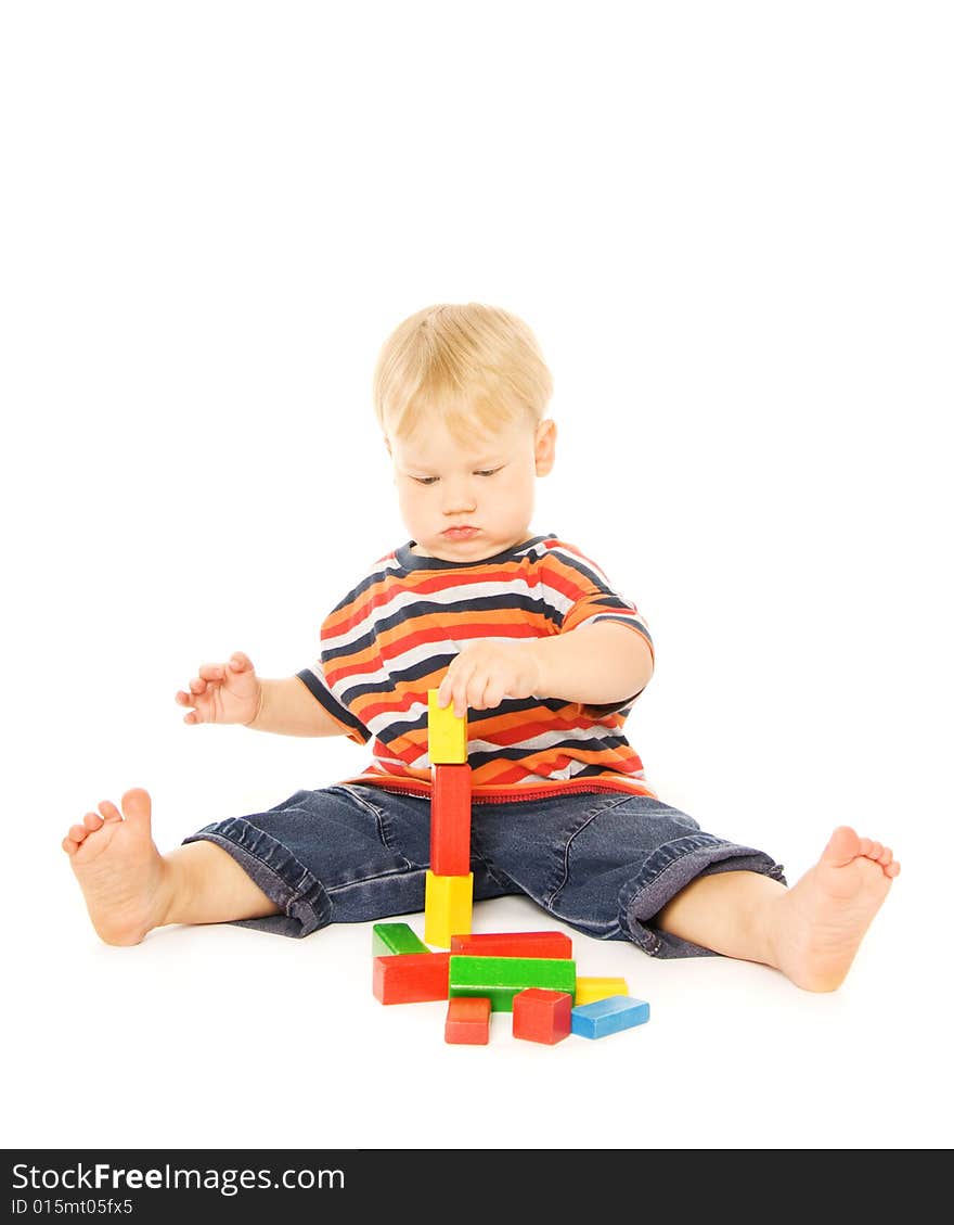 Beautiful young child playing intellectual game. Isolated on white background