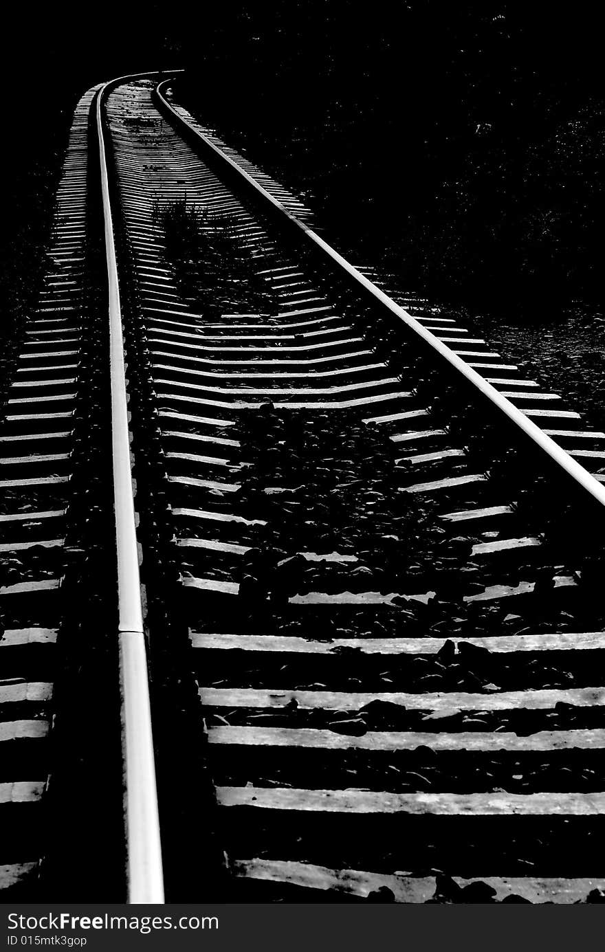 Looking down the train traks. shot in black and white. Looking down the train traks. shot in black and white