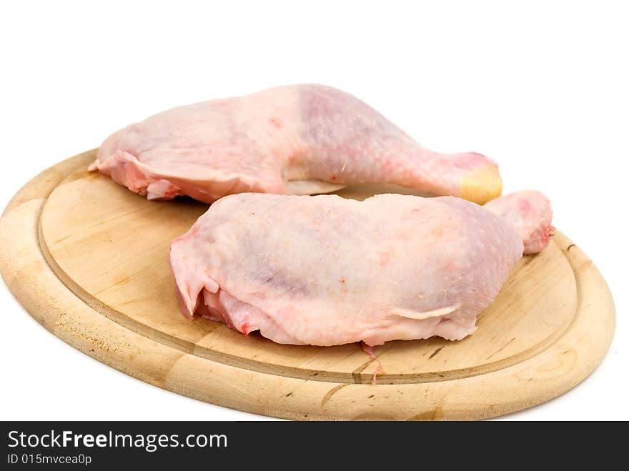 Fresh chicken legs-drumsticks-on the cutting board