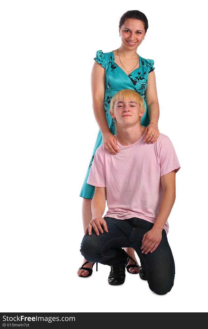 Young woamn stand behind young man siting on knee isolated