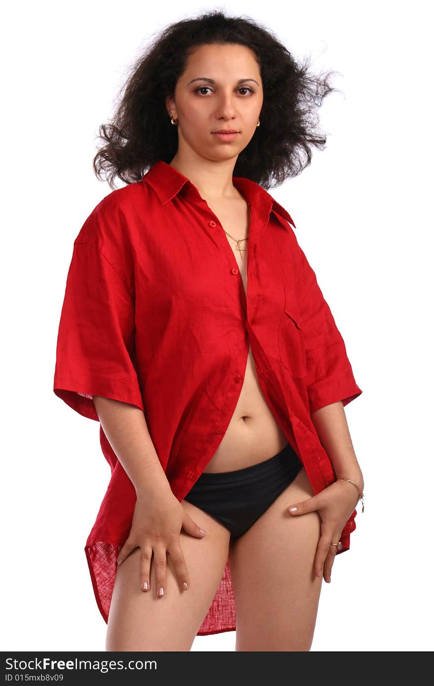 Curly-headed girl in red male shirt posing