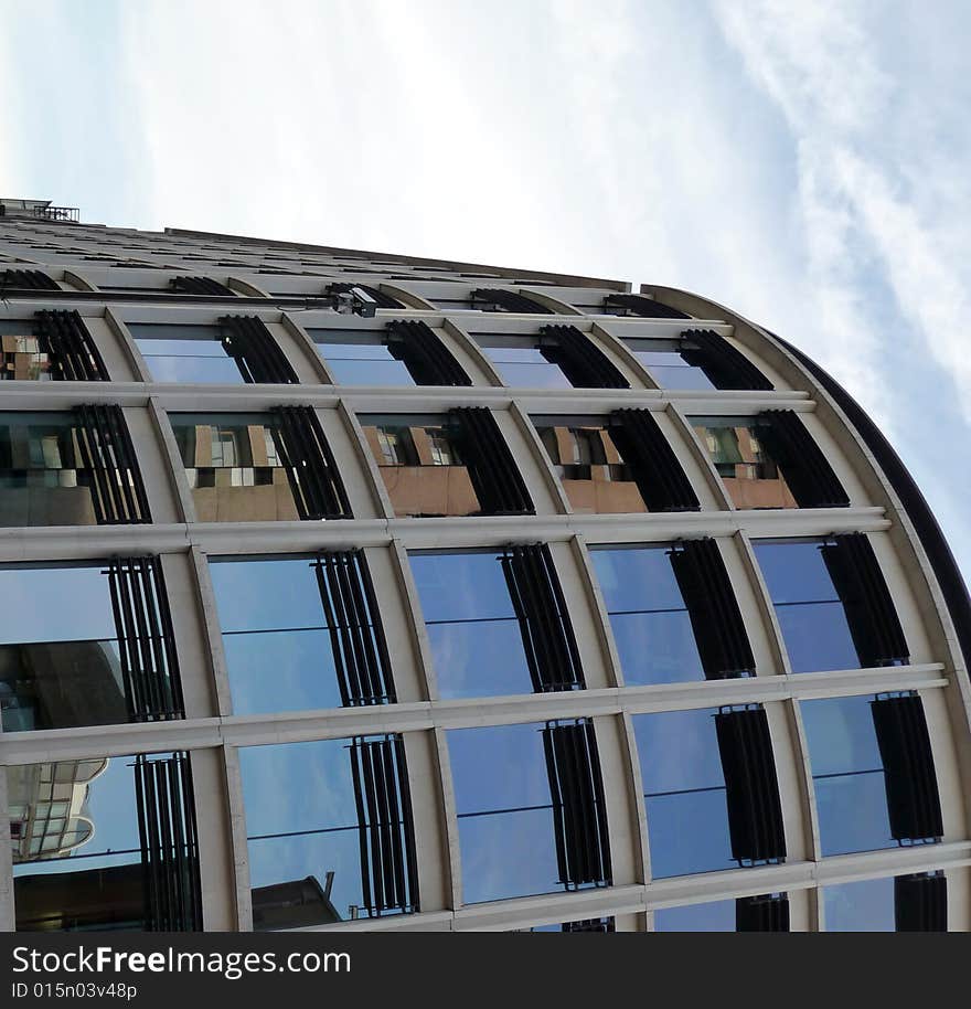 A modern office building that is curved. A modern office building that is curved.