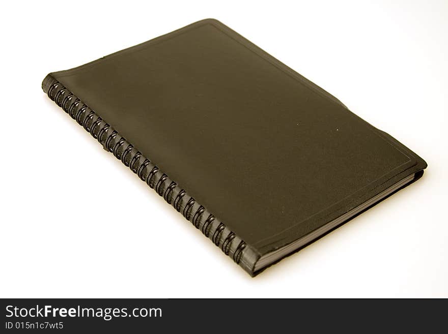 Black covered spirel bound closed date book