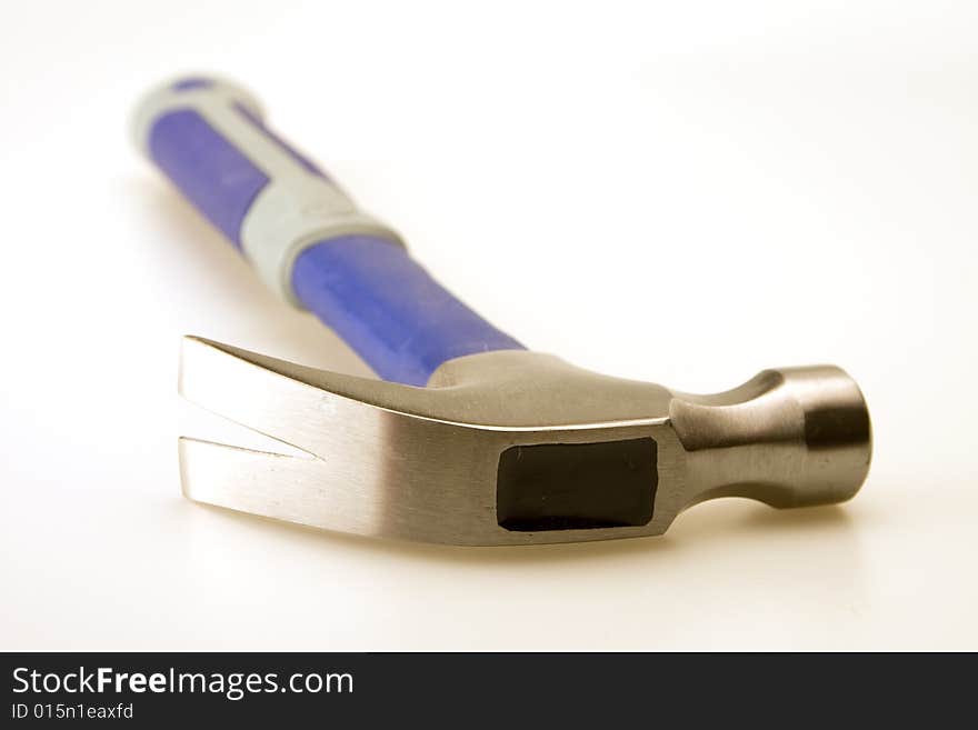 Close up of hammer head blue and gray handle. Close up of hammer head blue and gray handle