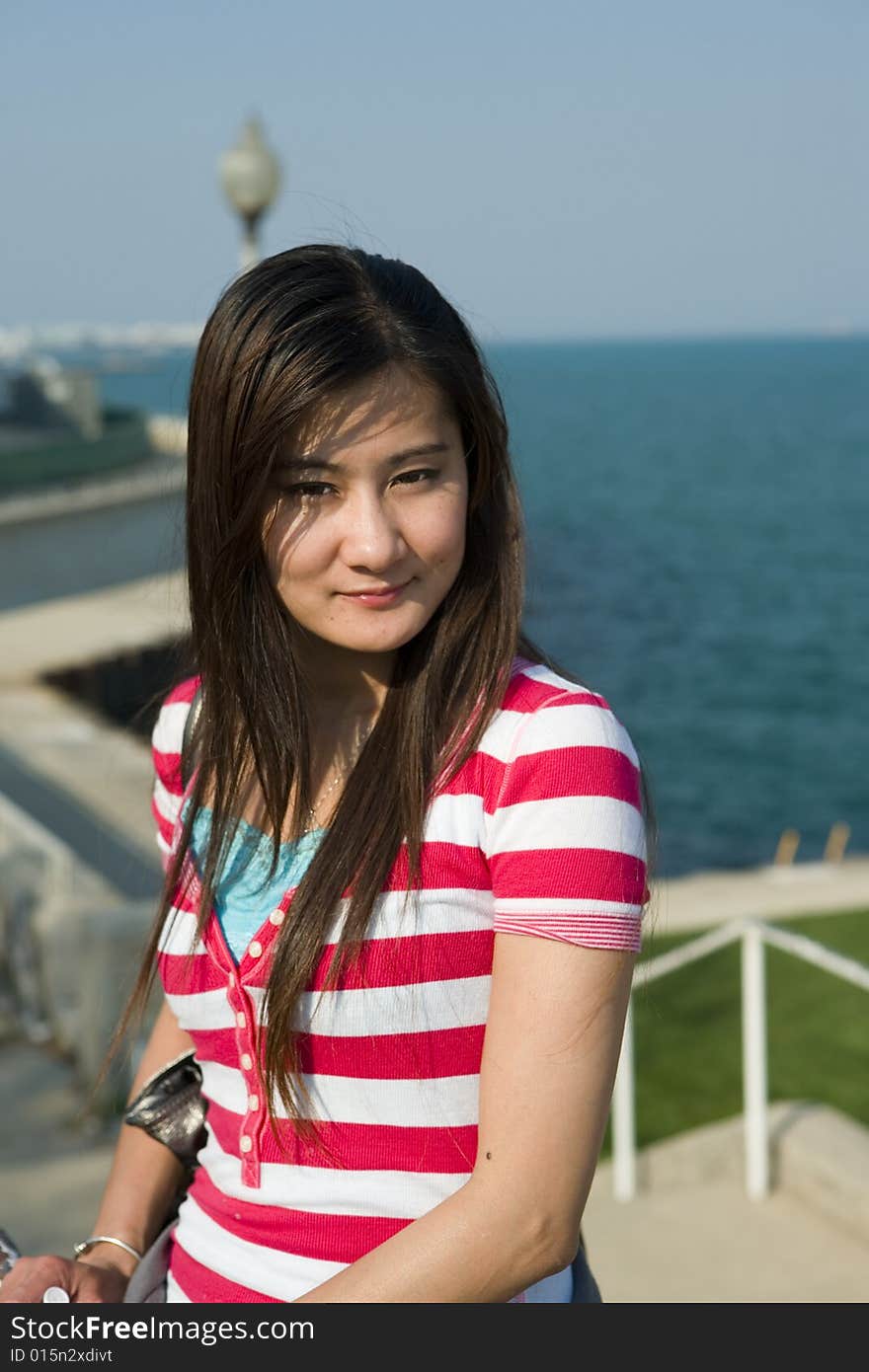 Young Asian Woman in the park by Lake Michigan, Chicago