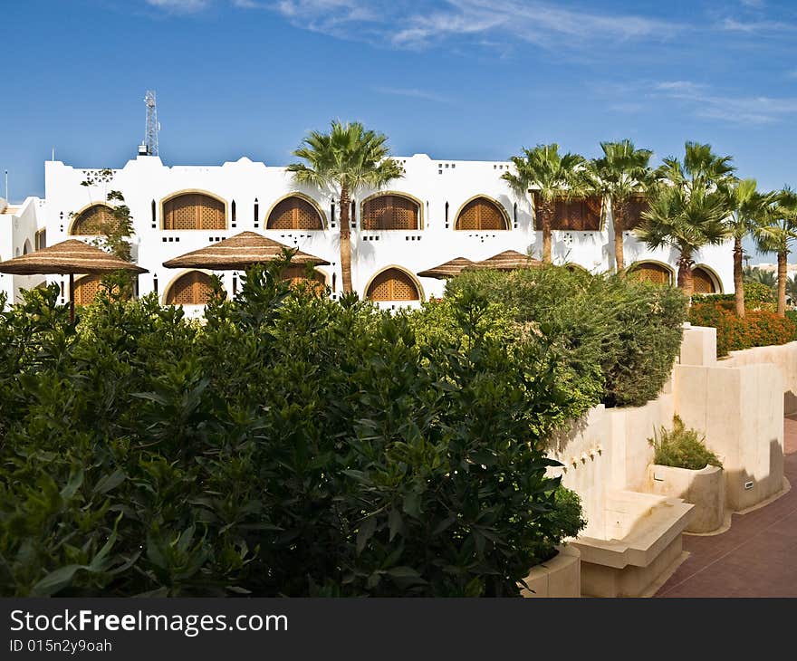 Building and palm trees in resort