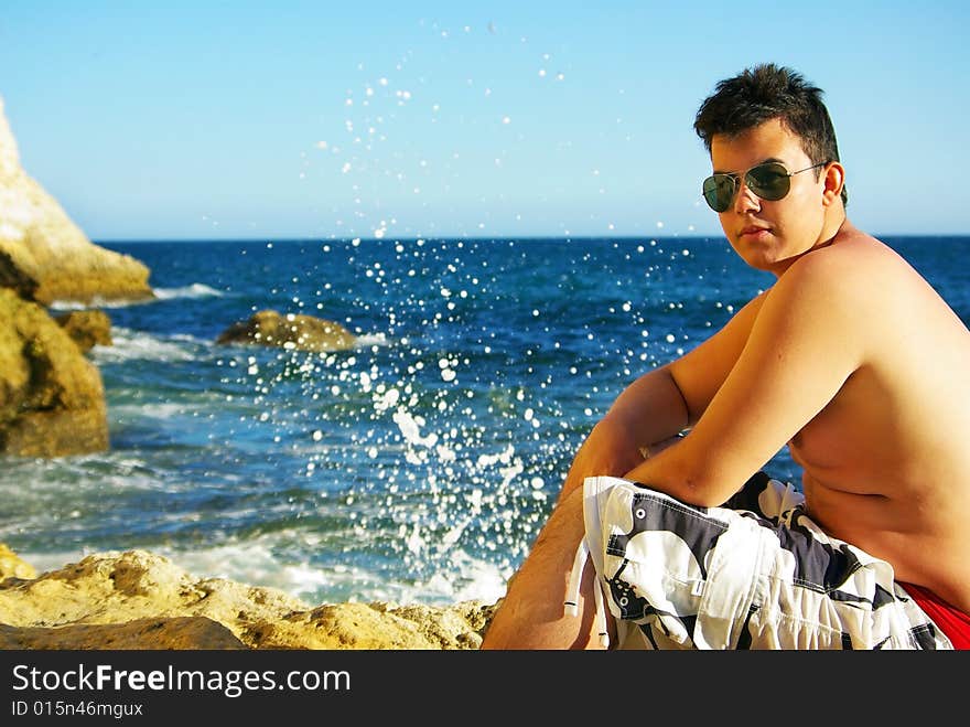 Young man next to sea.