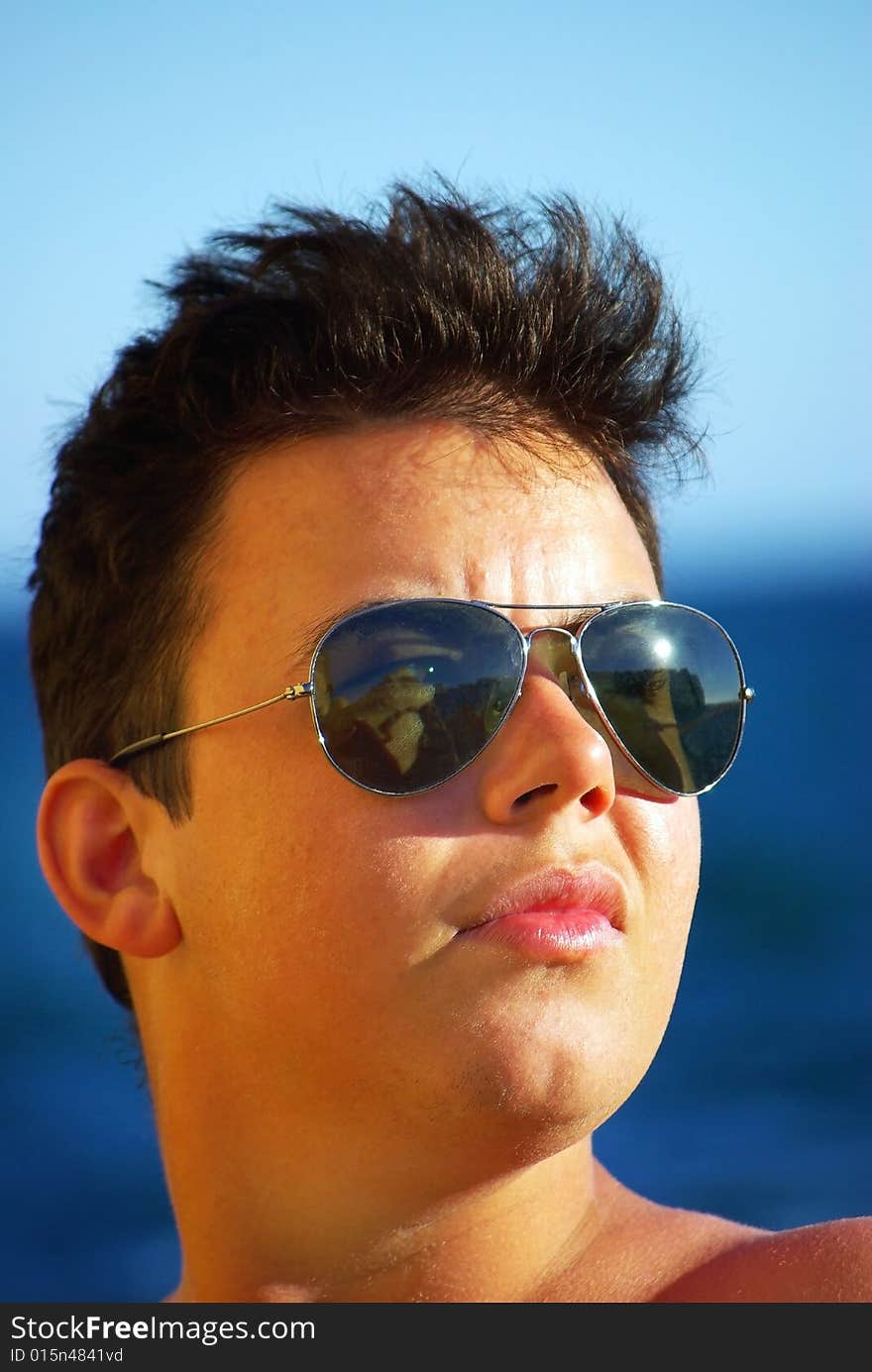 Young man next to sea.