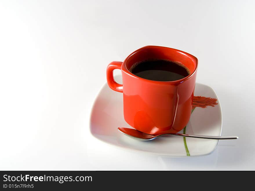 Isolated(with gentle refletion) cup of black coffee with spoon. Isolated(with gentle refletion) cup of black coffee with spoon.