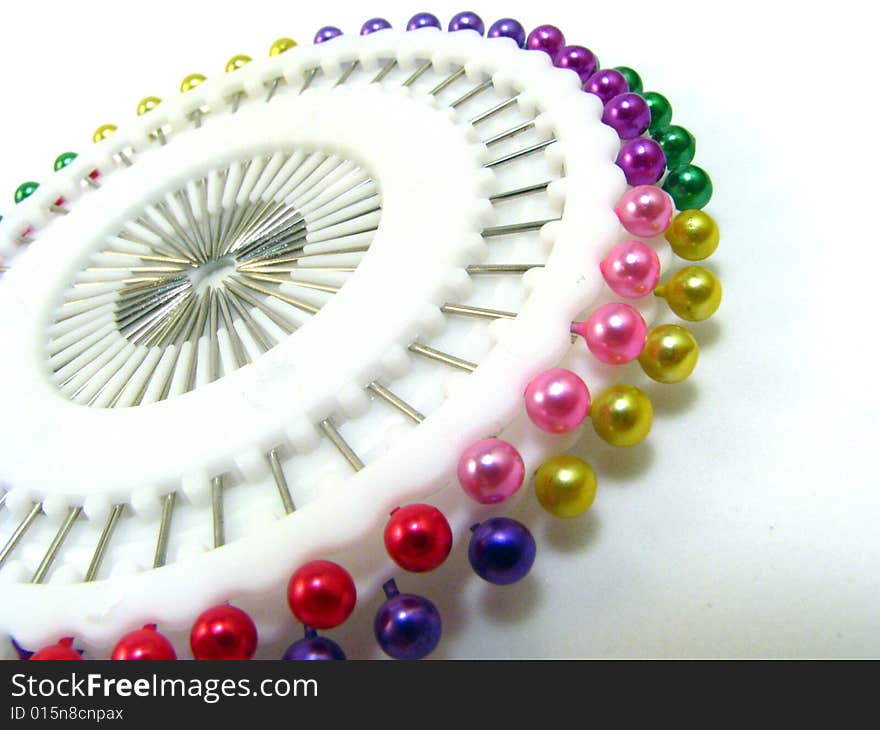 A wheel of multi-colored straight pins. A wheel of multi-colored straight pins