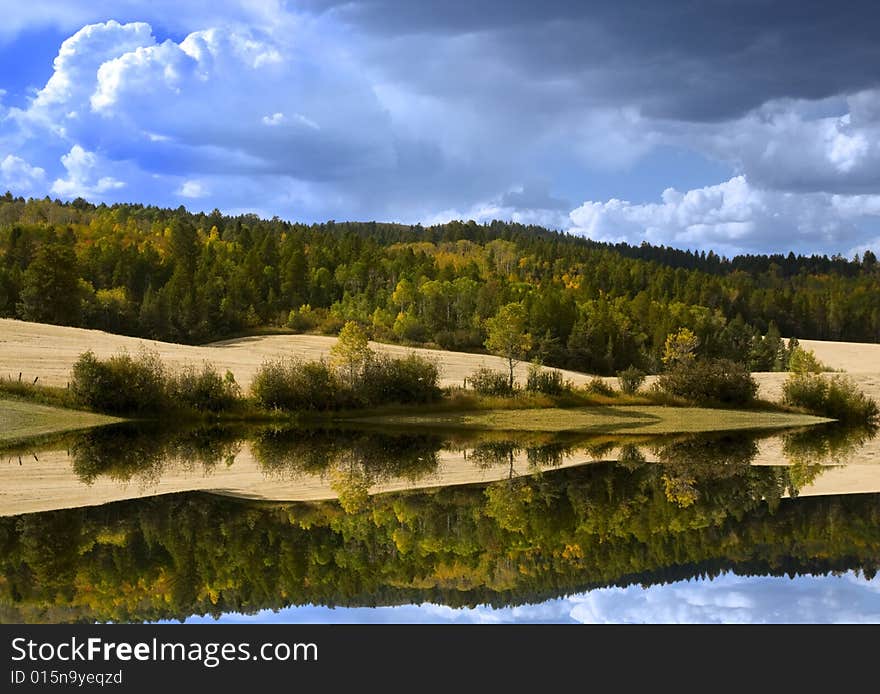 Storm in the mountains with reflections on water. Storm in the mountains with reflections on water