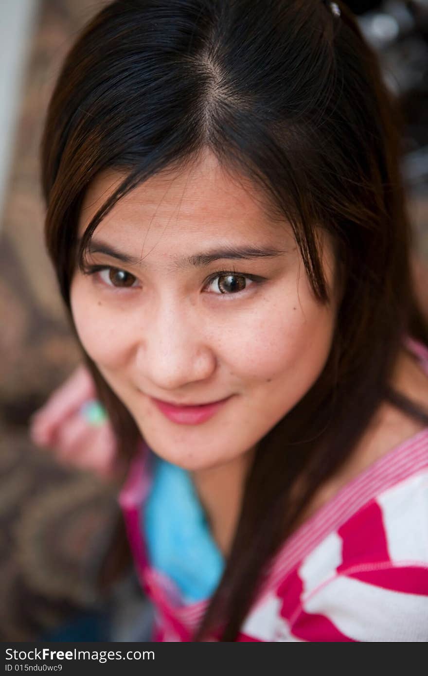 Young Asian Woman sitting on the sofa