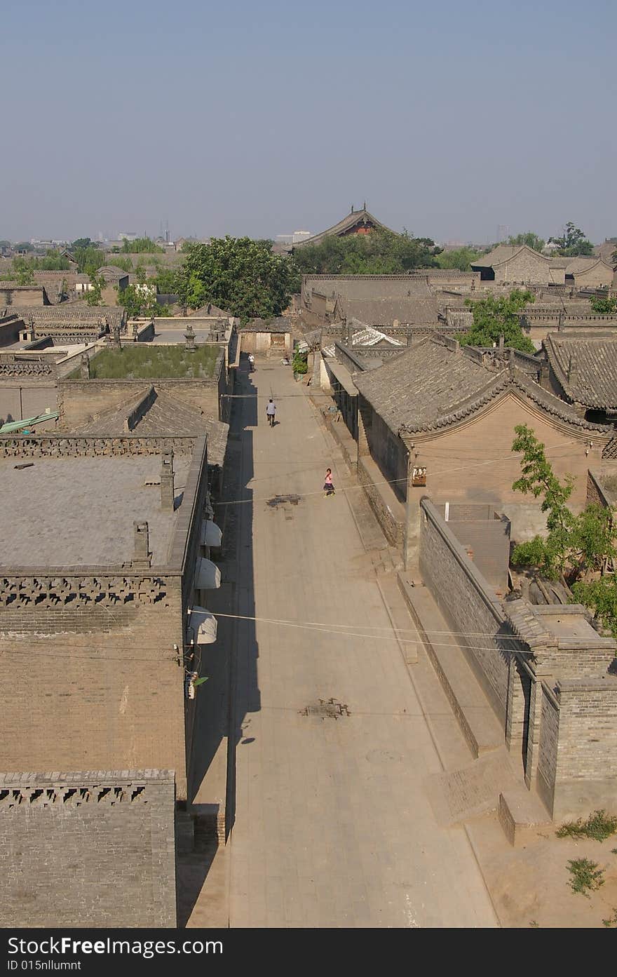 Ancient city Pingyao in China,old house and trees in the city. Ancient city Pingyao in China,old house and trees in the city.