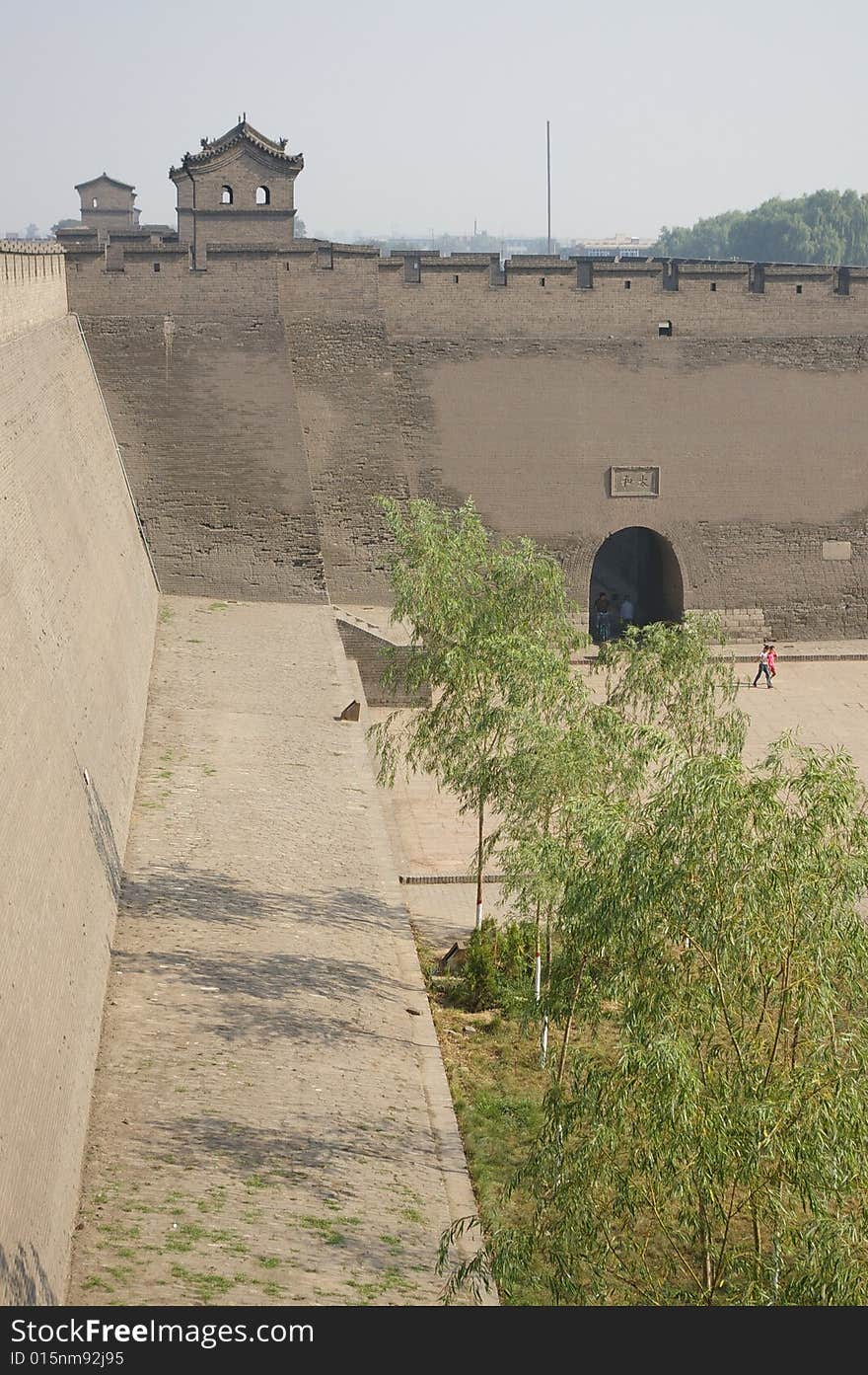 Ancient wall in China,a city gate,Pavilion and trees on the Castle.