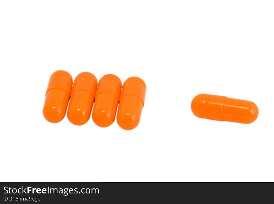 Vitamin pills on isolated white background