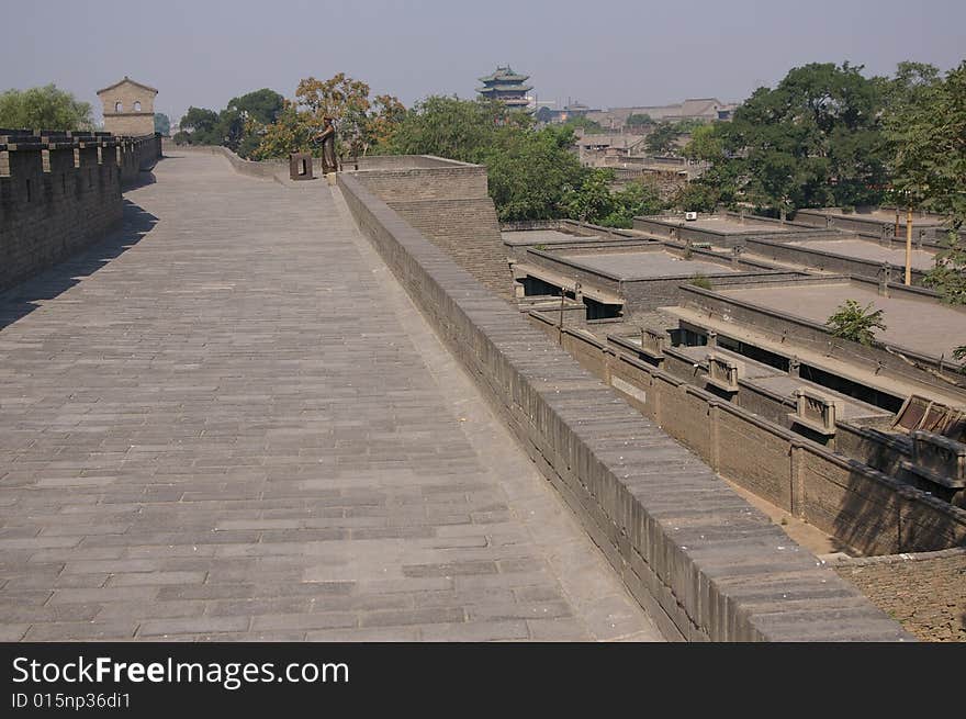 Ancient city Pingyao in China,old rampart and trees in the city. Ancient city Pingyao in China,old rampart and trees in the city.