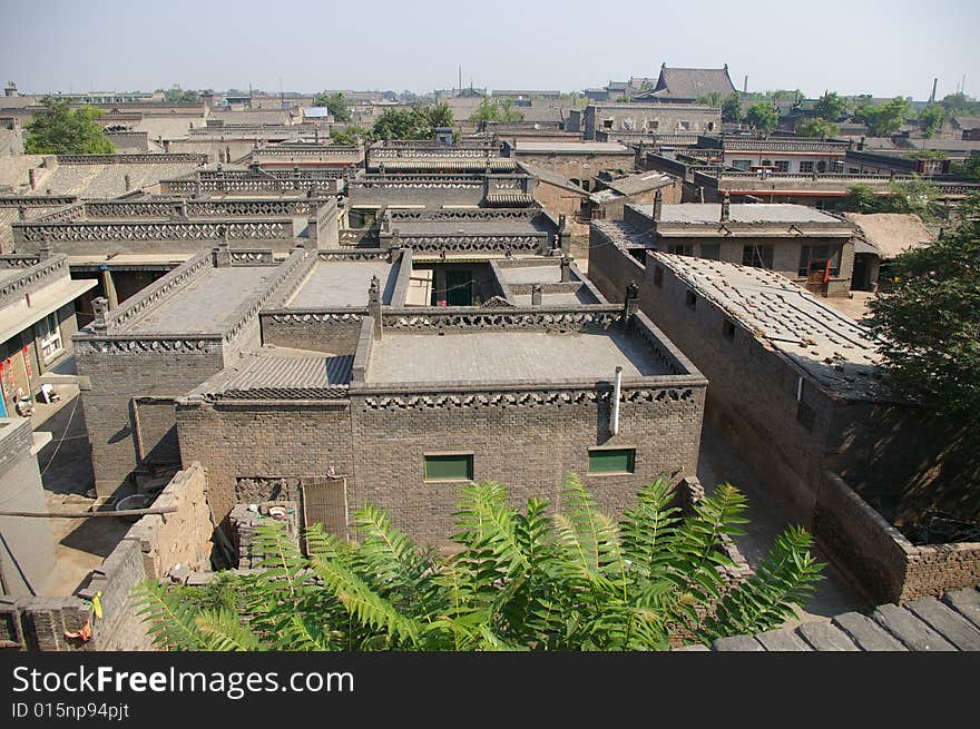 Ancient city Pingyao in China,old house and trees in the town. Ancient city Pingyao in China,old house and trees in the town.