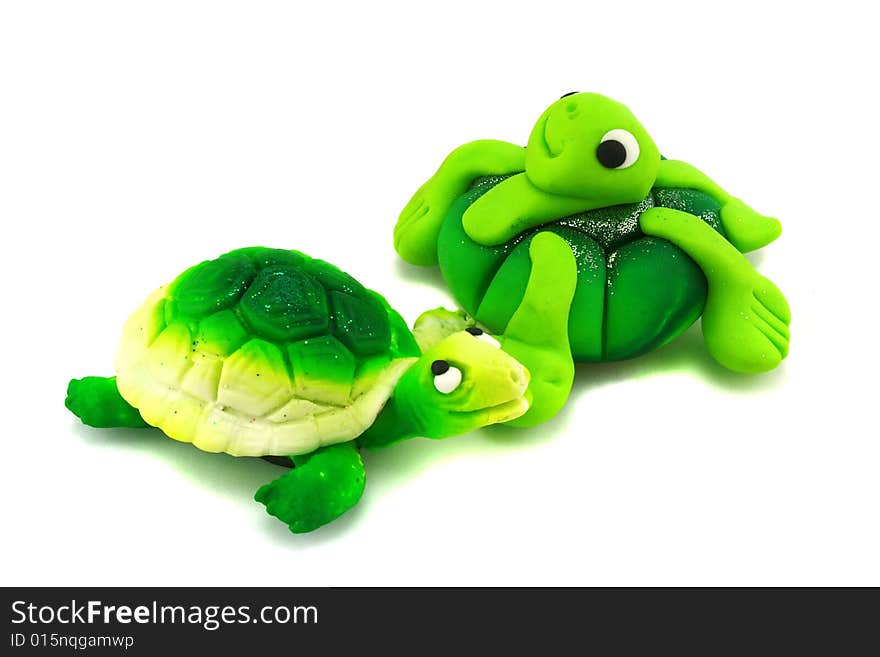 Two hand-made green turtles