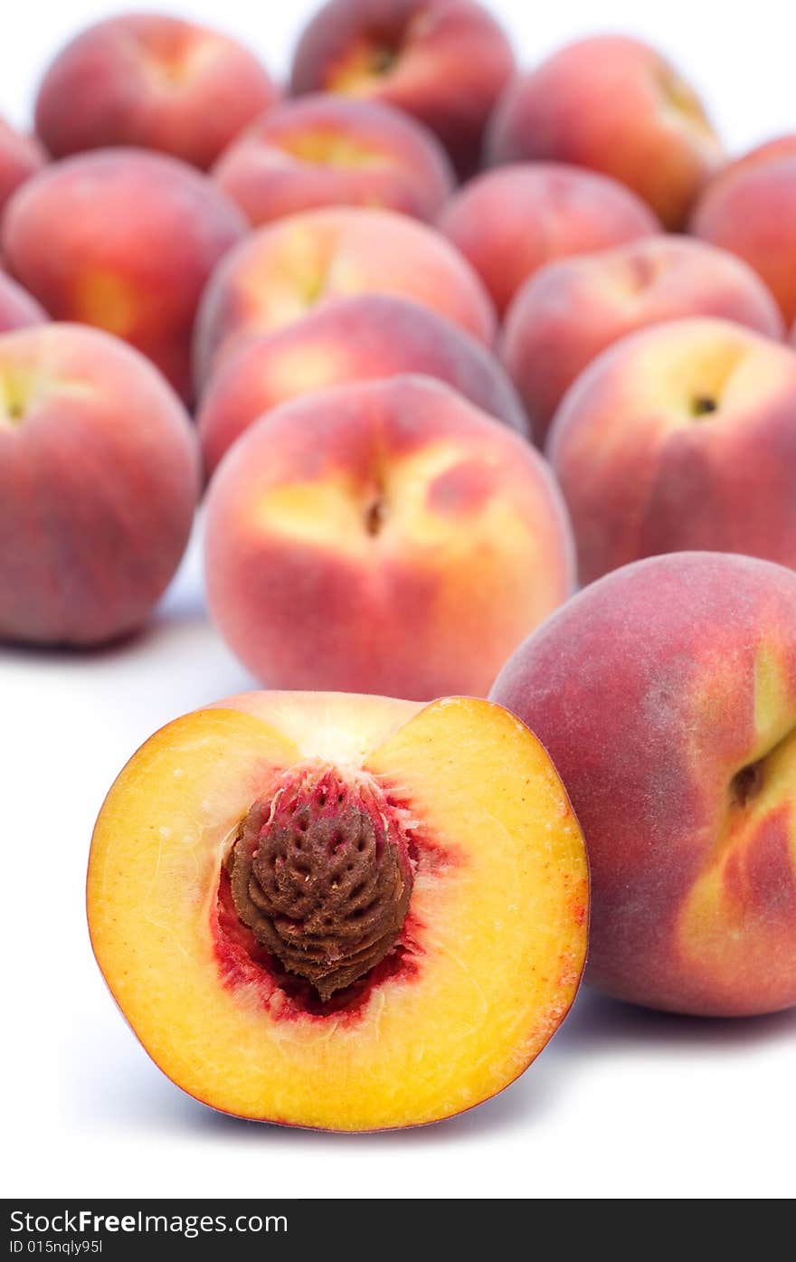 Fresh peaches on white background