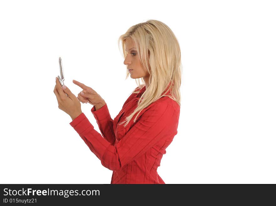 Young woman reading or writing a SMS, using her mobile.Isolated over white.