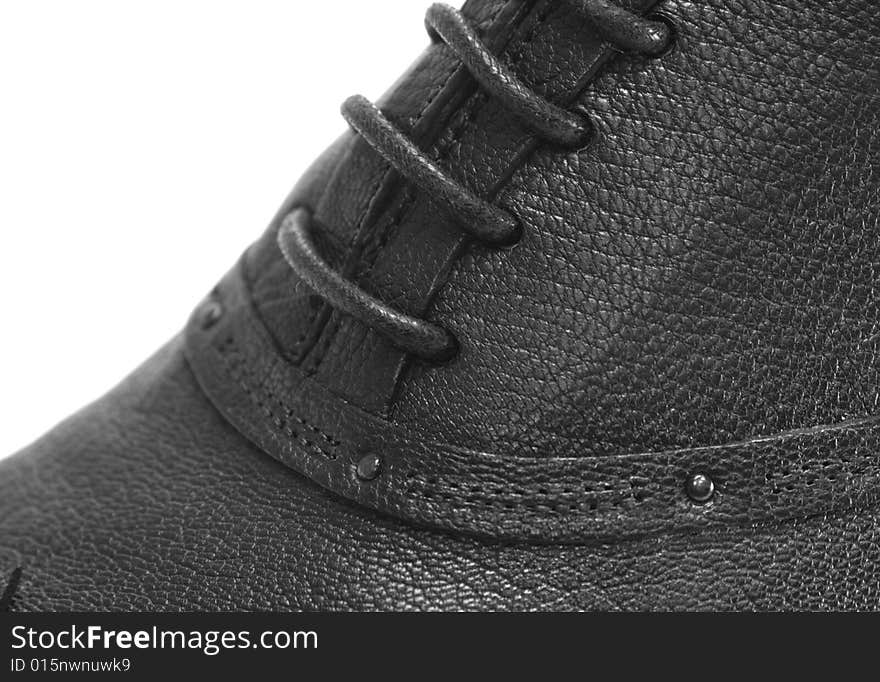 Fragment of mens shoe. Black leather. Fragment of mens shoe. Black leather.