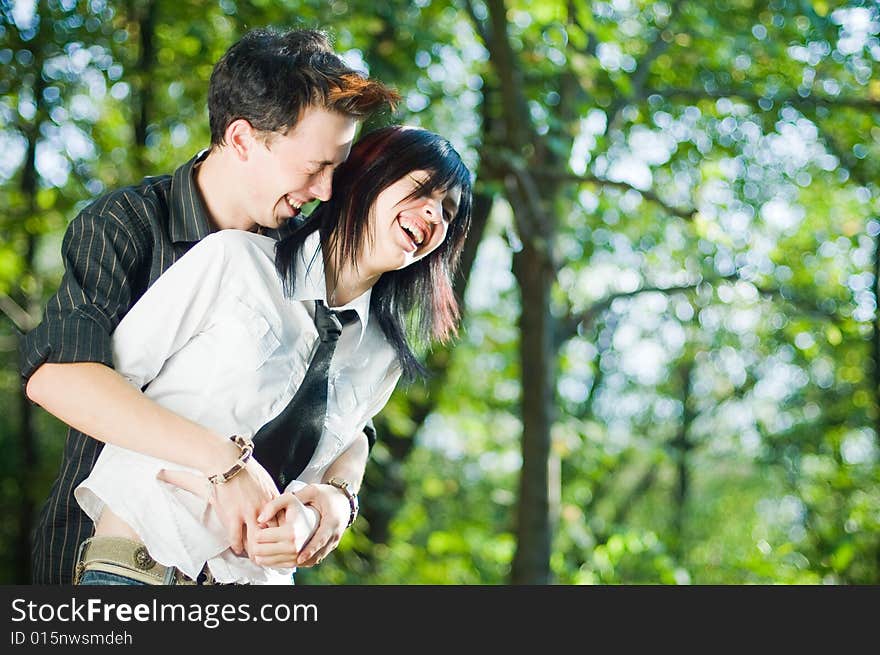 Young beautiful couple laughing outside. Young beautiful couple laughing outside