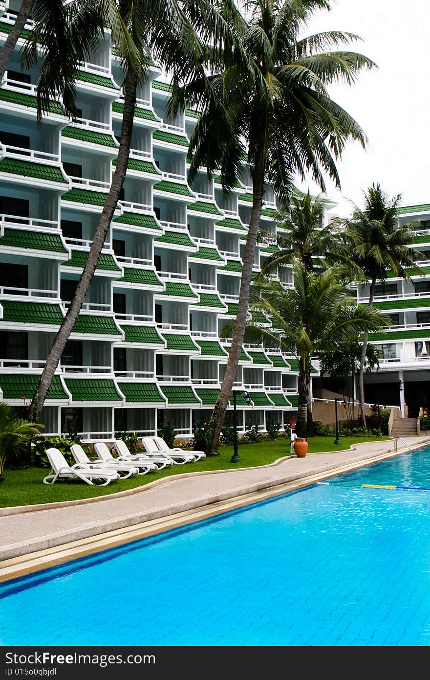 Tropical resort buildings and swimming pool.