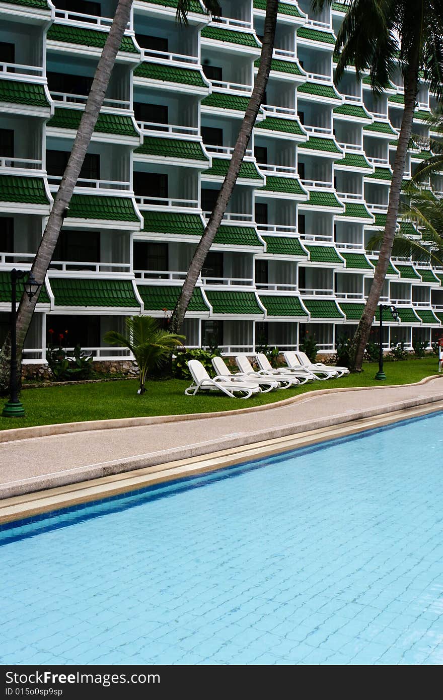 Tropical resort buildings and swimming pool.