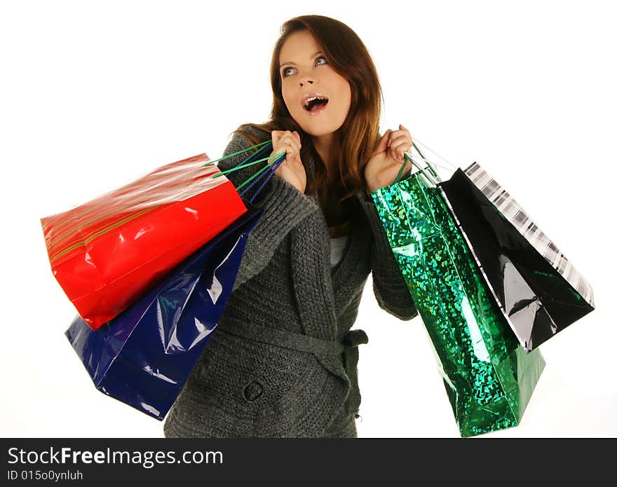 Shopping happy woman. Isolated over white background.