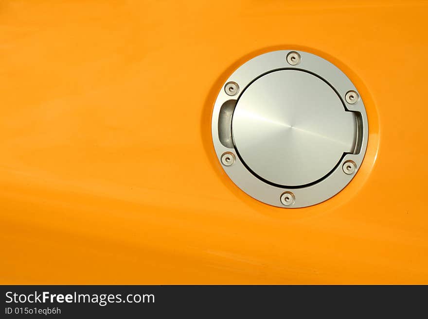 A Yellow sports car gas cap