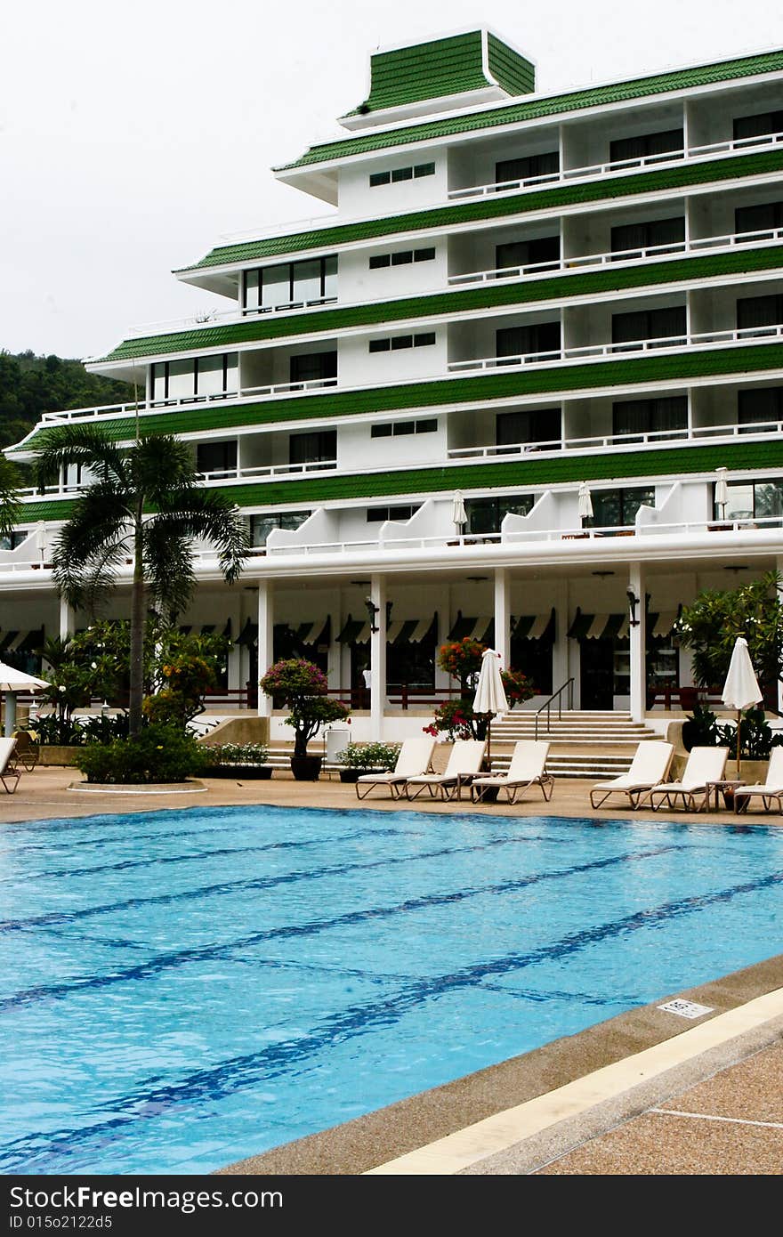 Tropical resort buildings and swimming pool.