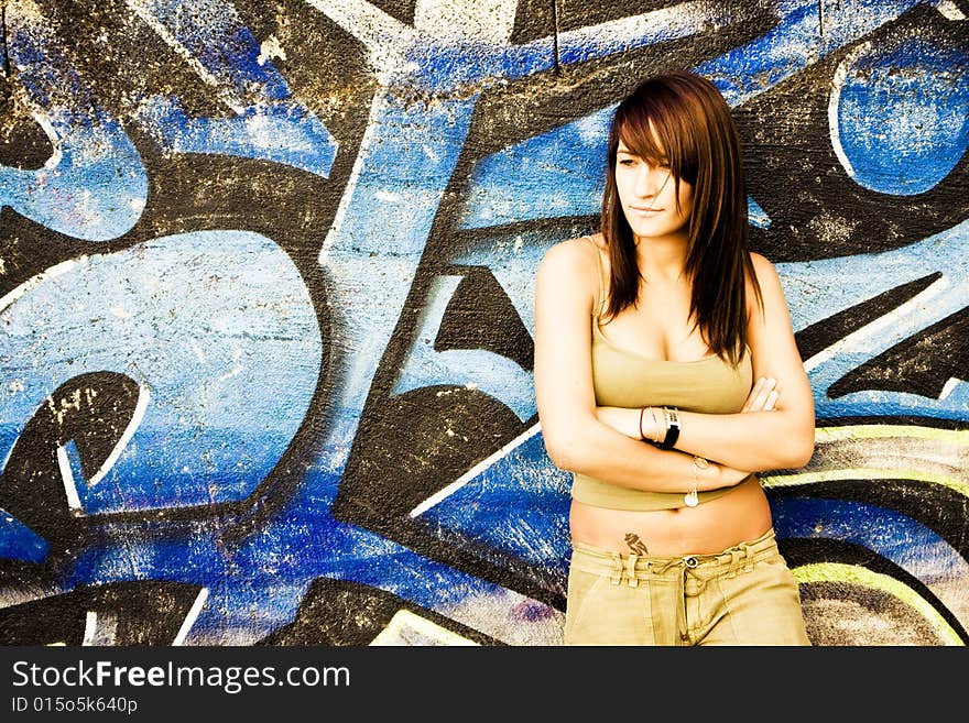 Young woman in casual clothing with serene expression.