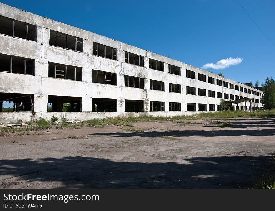 Abandoned building with broken windows. Perspective view