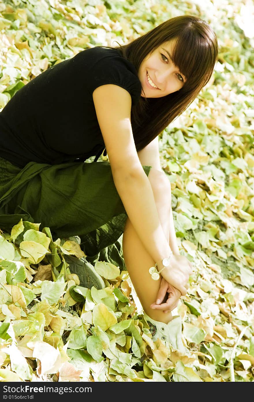 Young Woman In Autumn Background