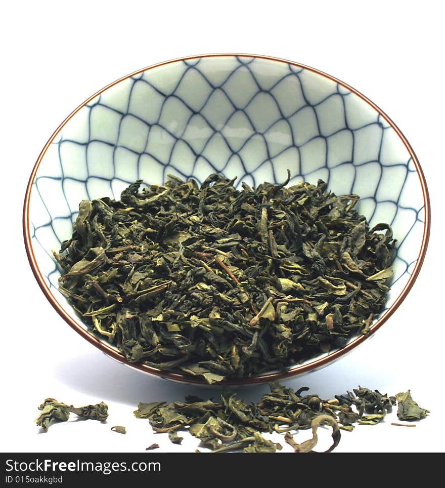 China tea bowl witg green tea leavs. China tea bowl witg green tea leavs