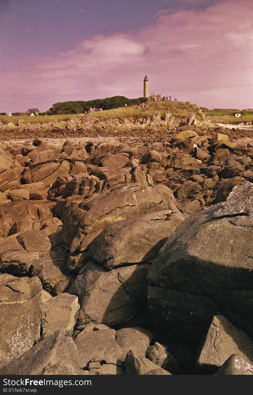 High lighthouse on the rocky coast