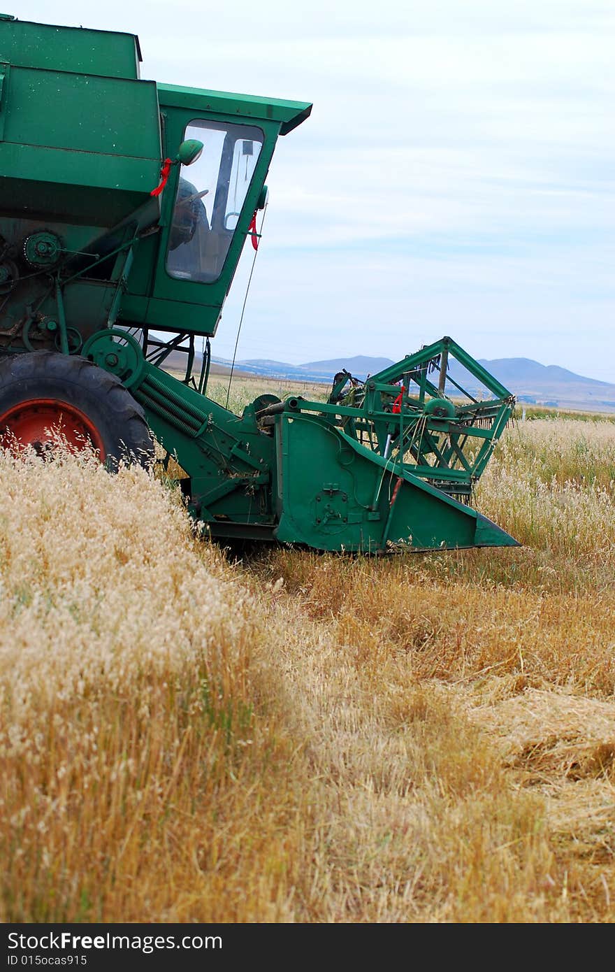 Combine on a background of a field